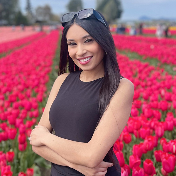 Alejandra Hernandez in field of red tulips.
