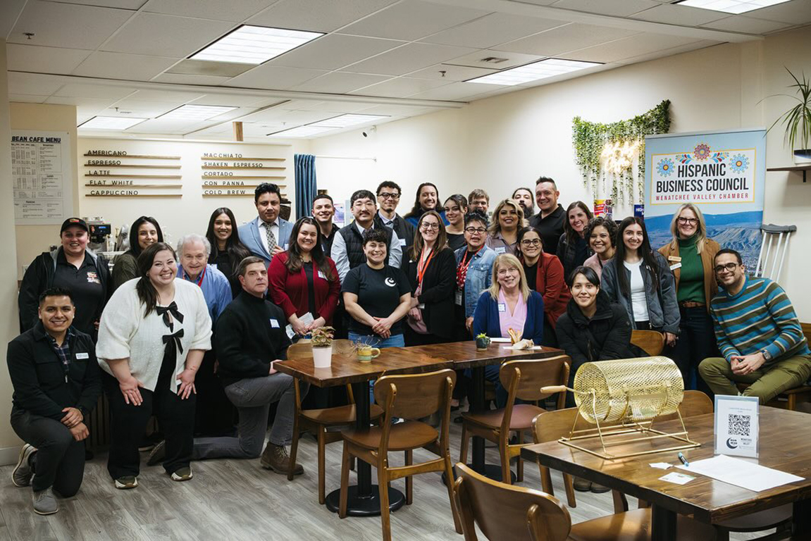 Group photo of local business owners and community members at a Conexión event