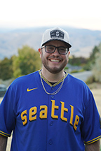 Portrait of Jaime Mendoza standing outside.